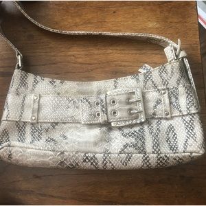 Enjoy this elegant, silver/gray, imitation snake skin handbag/purse.